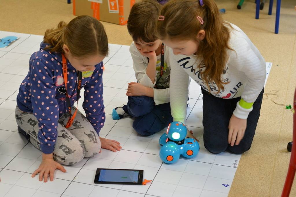 Children interact with a programmable robot